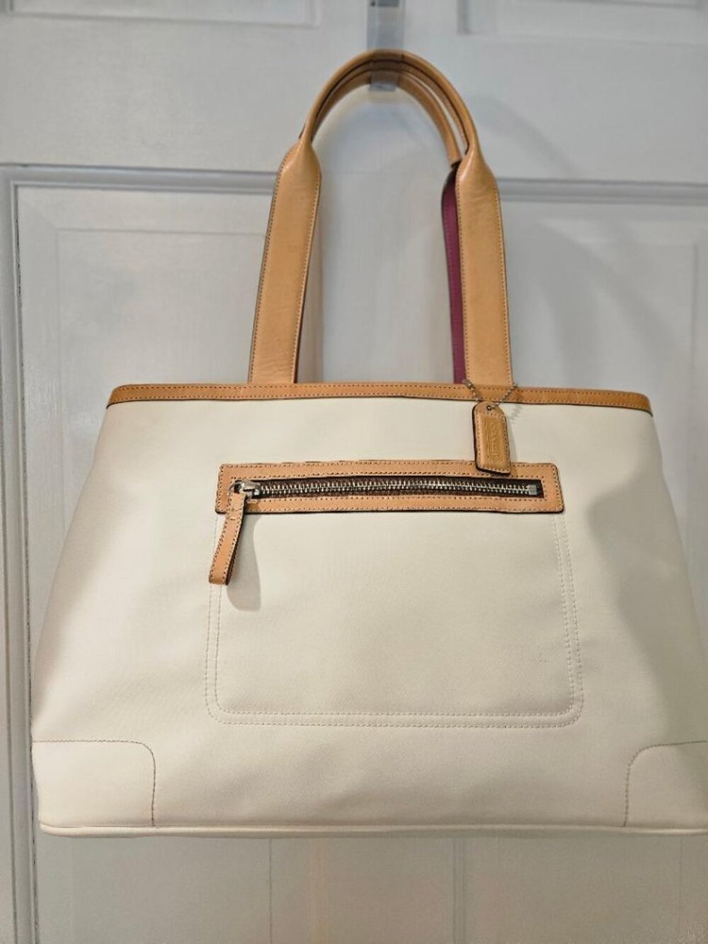 White COACH nylon tote bag w leather trim and double handles.